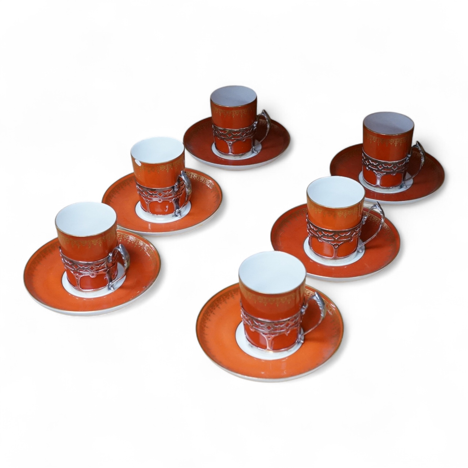 A set of six silver-mounted Royal Worcester coffee cans and saucers, cans 7cm high., Condition - variable